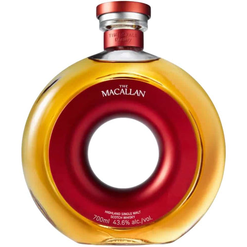Macallan Time Space Mastery Scotch Whisky in a uniquely crafted circular bottle, symbolizing life's journey and heritage. Macallan Time Space Mastery Scotch Whisky in a uniquely crafted circular bottle, symbolizing life's journey and heritage.