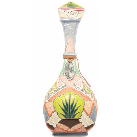 Elegant bottle of Dulce Amargura Extra Añejo Tequila with intricate colorful design Elegant bottle of Dulce Amargura Extra Añejo Tequila with intricate colorful design