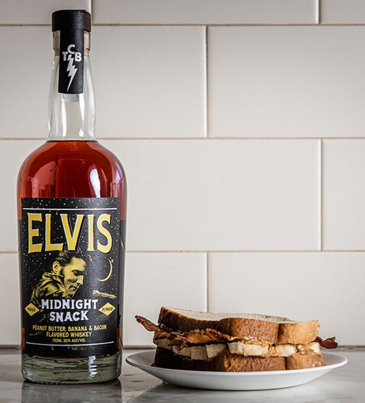 Elvis Midnight Snack Whiskey bottle and sandwich on a plate, showcasing peanut butter, banana, and bacon flavor combination.