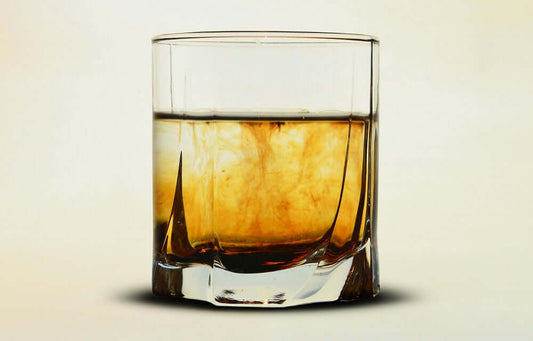 whiskey into glass