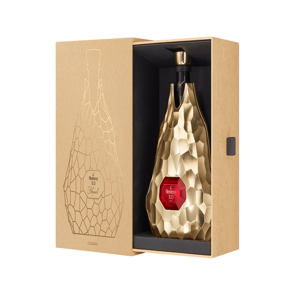 Hennessy XO Limited Edition by Jean-Michel Othoniel in gold bottle, opened box, showcasing luxury cognac artistry.