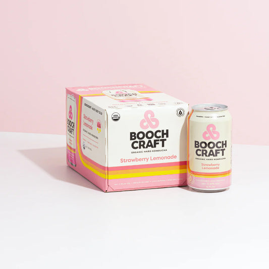 Boochcraft Strawberry Lemonade Hard Kombucha can and box packaging against a pink background