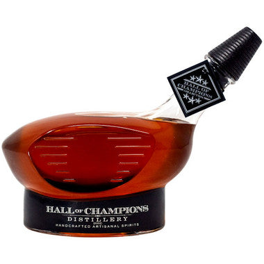 Hall of Champions Golf Bourbon bottle showcasing handcrafted design and rich amber color, celebrating Cooperstown's heritage and excellence.